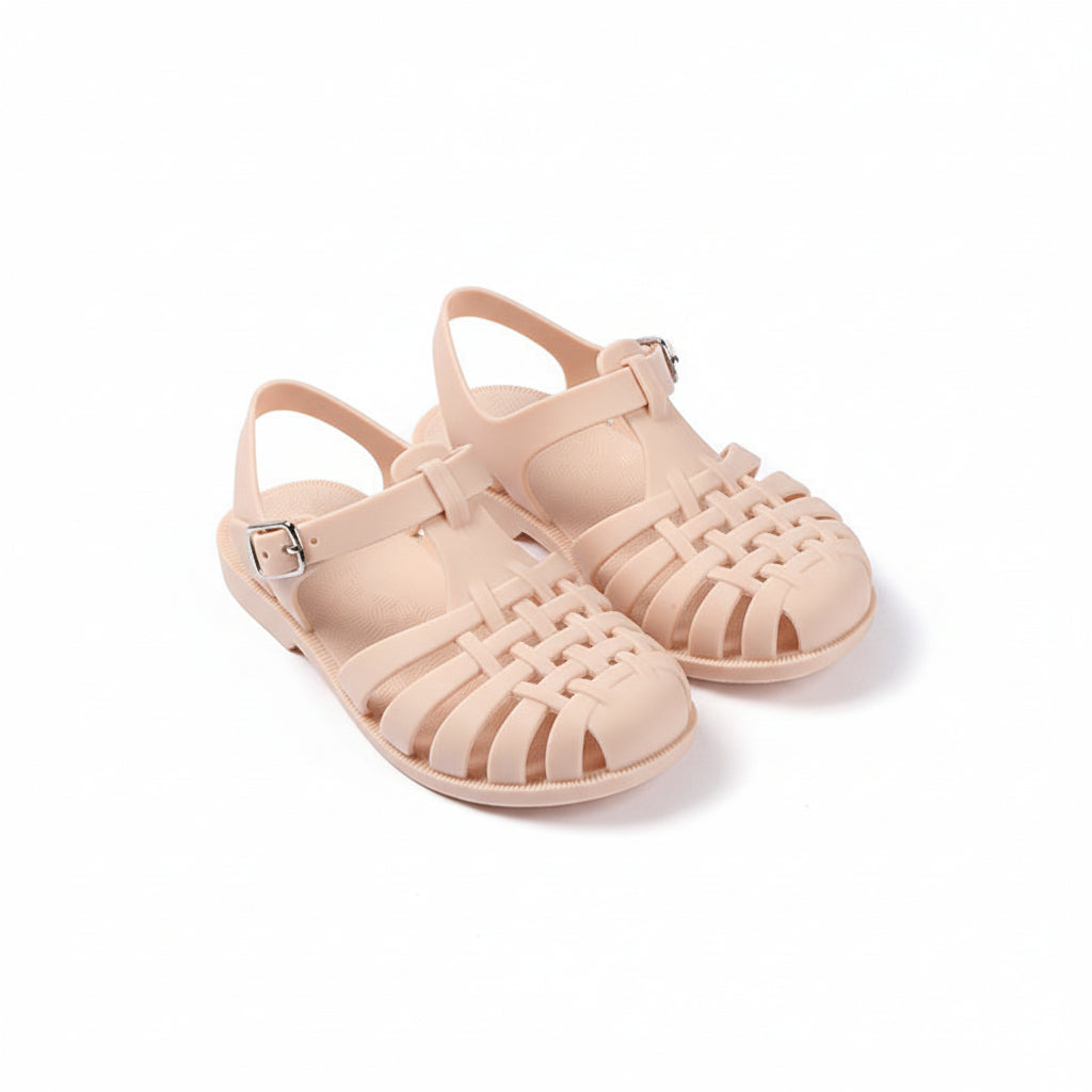 Beige jelly sandals on a white background with text and branding elements.