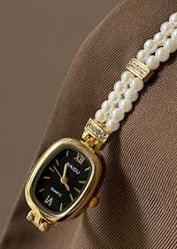 Gold Strap Black Surface