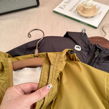 The Minimal Shell: Solid-Color Short Hooded Shell Jacket
