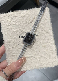 Silver shell black surface