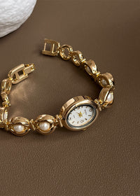 Gold Strap White Surface