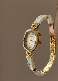 Gold Strap White Surface