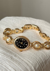 Gold Strap Black Surface