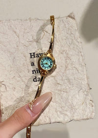 Gold Strap Green Surface